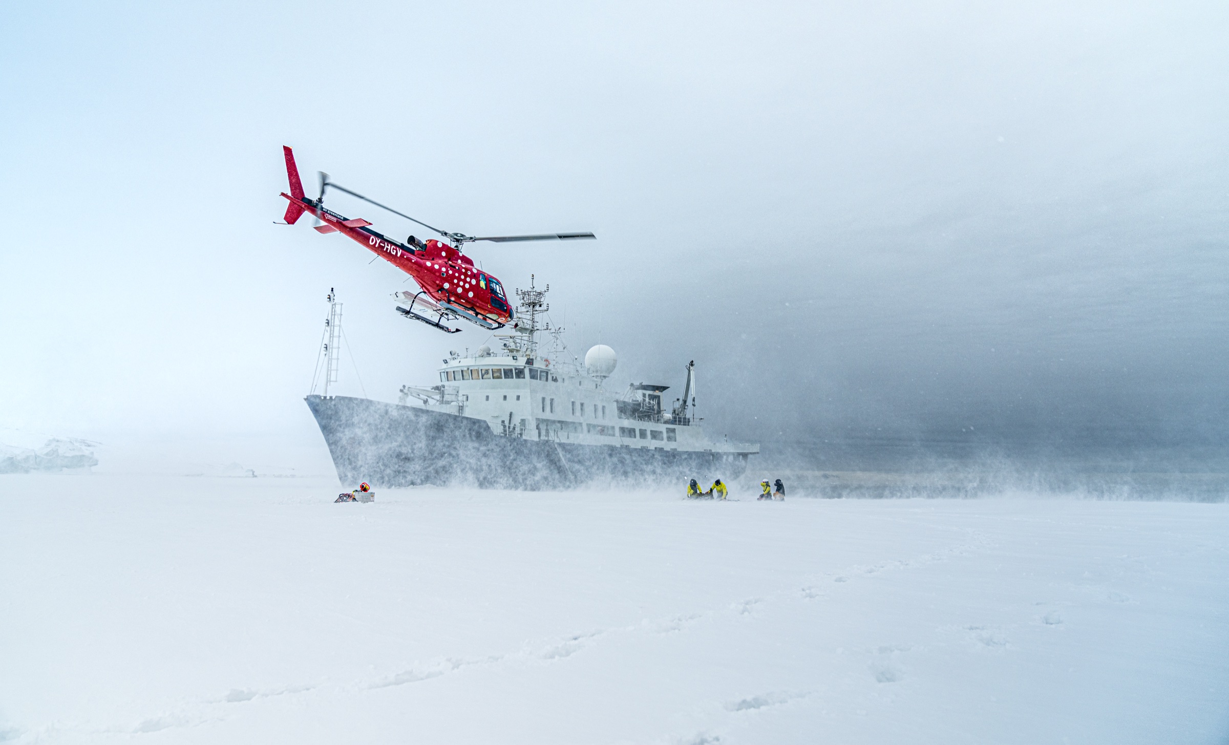 Heli, ship, and skiers on the ice — the team assembled