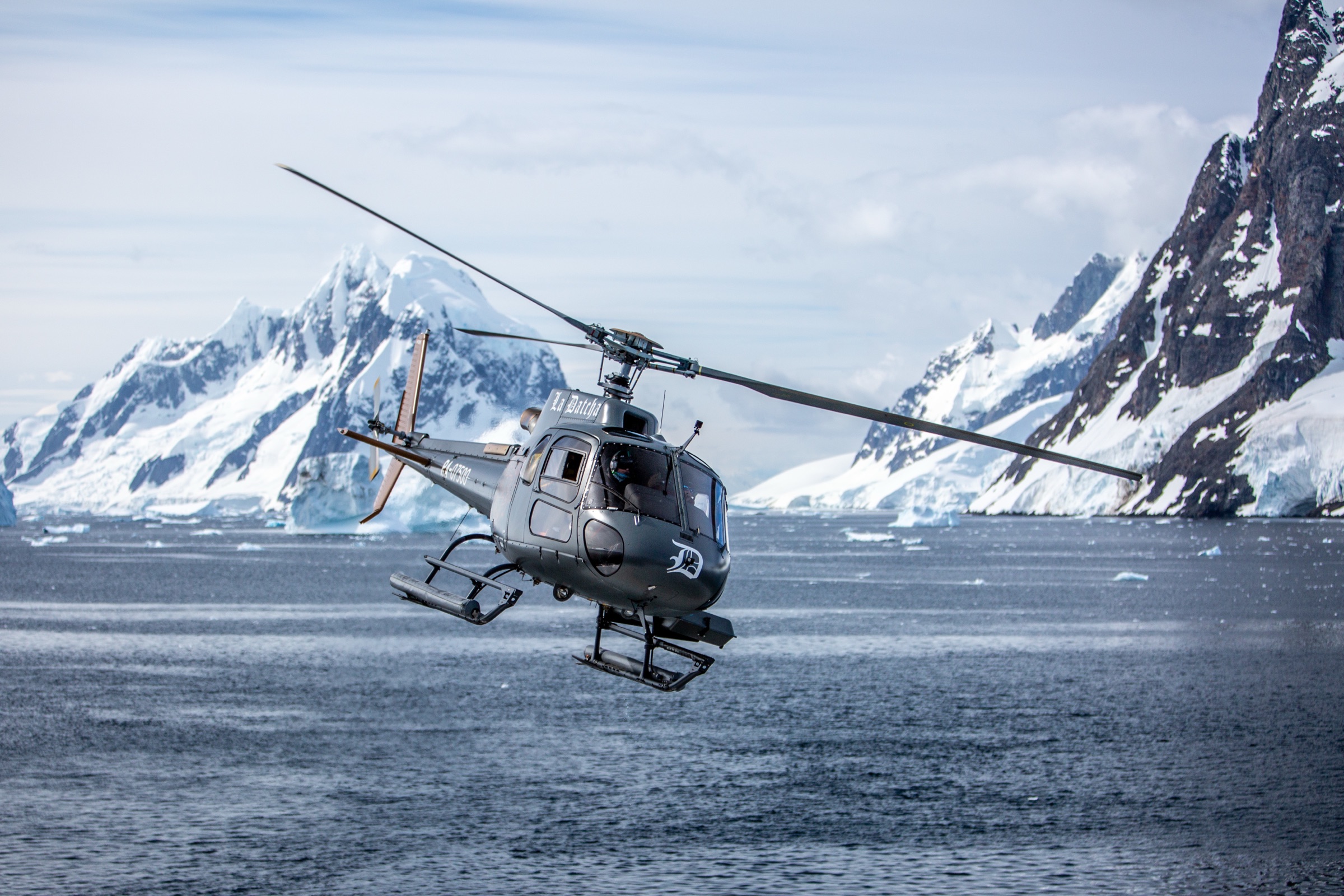 La Datcha helicopter working low over polar water