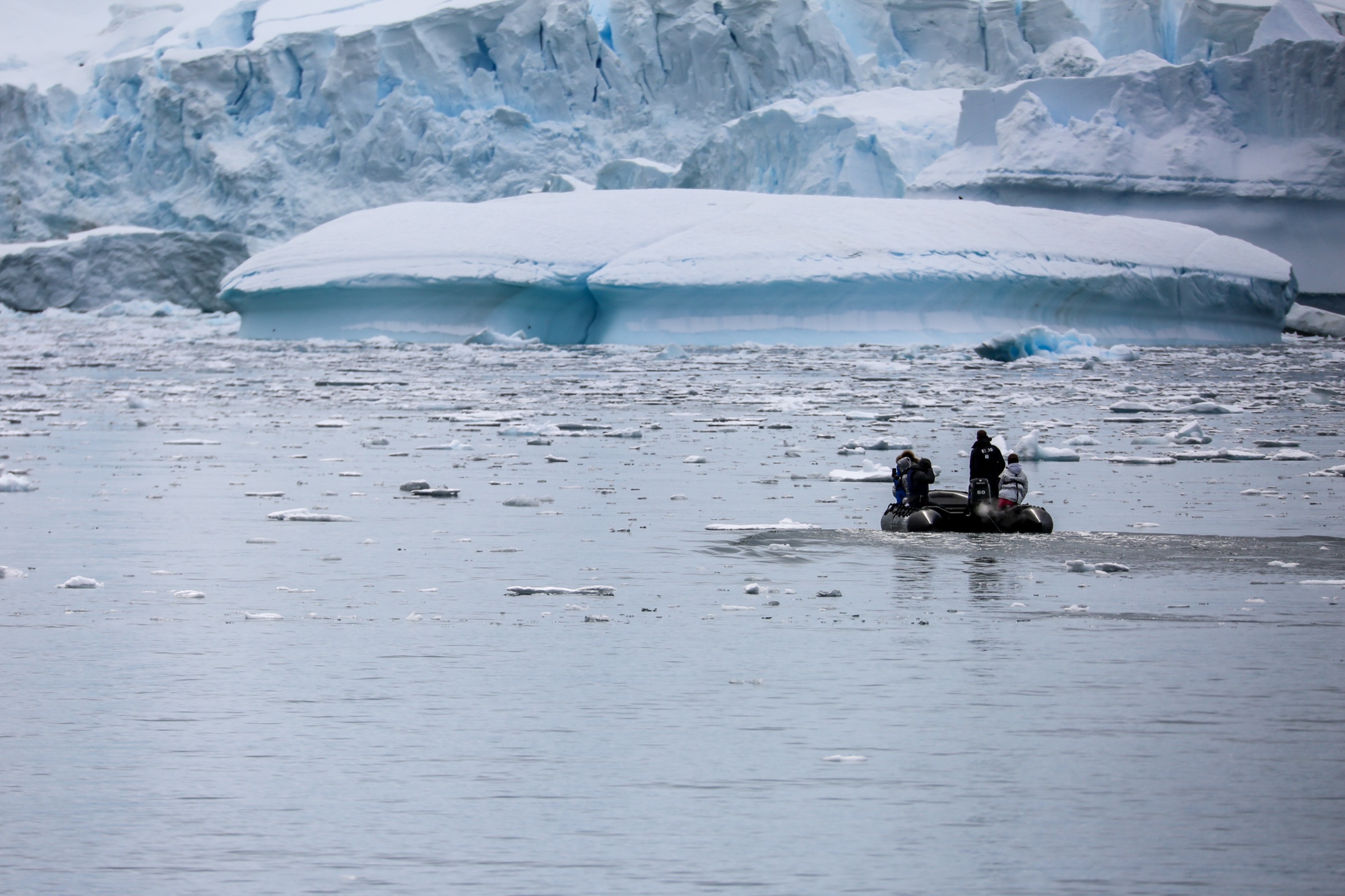 Zodiac crew working between icebergs